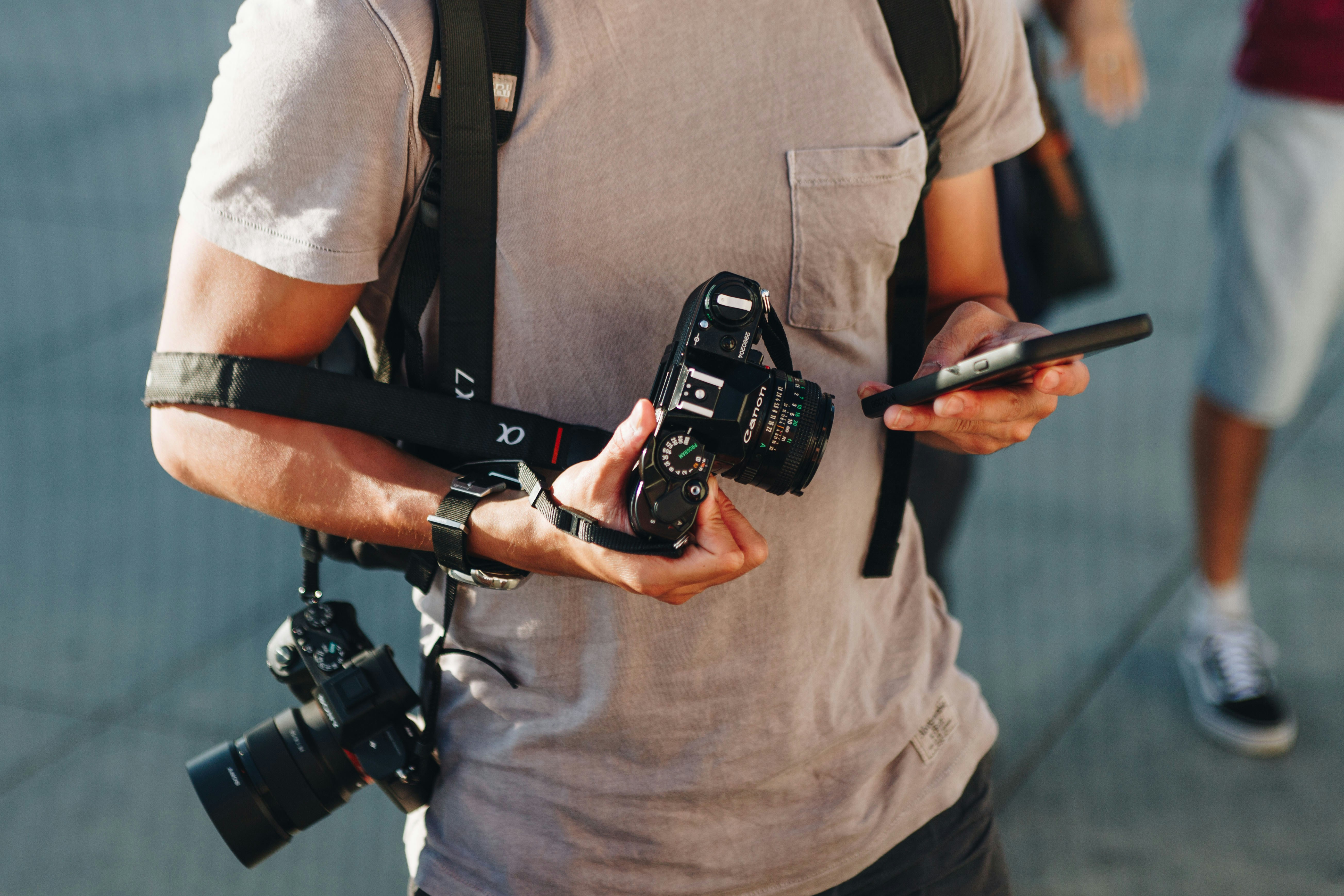 A photographer preparing a camera on safari